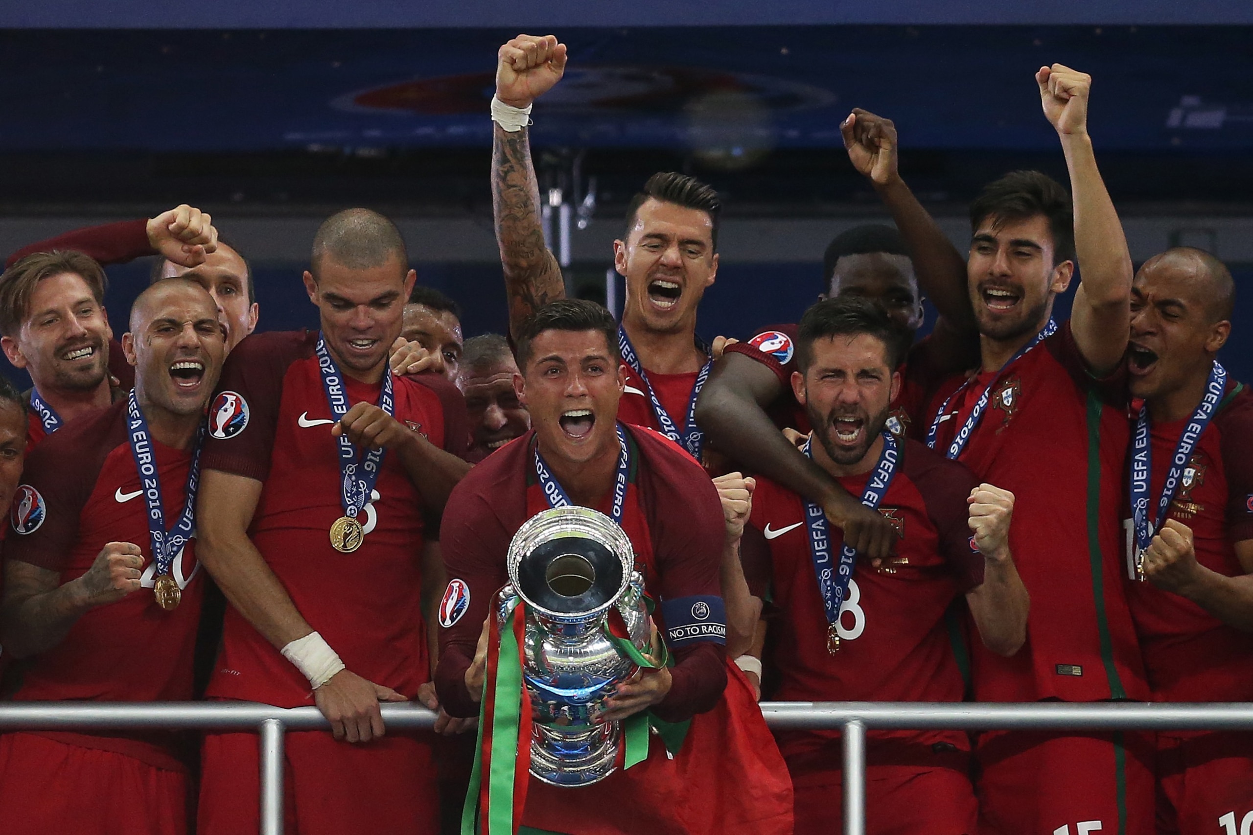 PARIS, FRANCE - JULY 10: Cristiano Ronaldo of Portugal lifts the trophy following the UEFA Euro 2016 Final match between Portugal and France at Stade de France on July 10, 2016 in Paris, France. (Photo by Chris Brunskill Ltd/Getty Images)