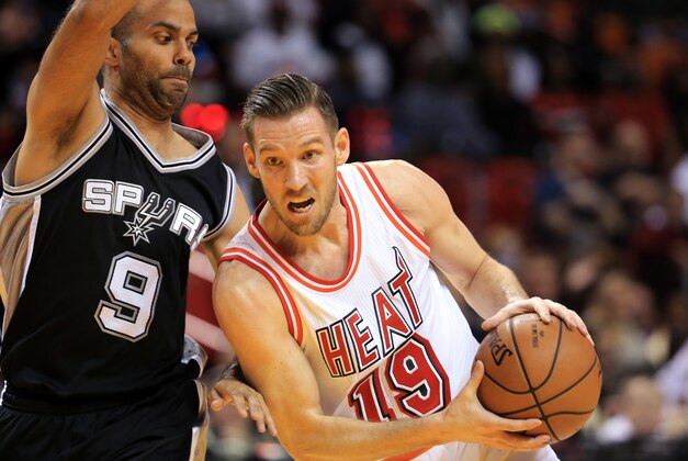 Feb 9, 2016; Miami, FL, USA; Miami Heat guard Beno Udrih (19) dribbles the ball around San Antonio Spurs guard Tony Parker (9) during the first half at American Airlines Arena. Mandatory Credit: Steve Mitchell-USA TODAY Sports