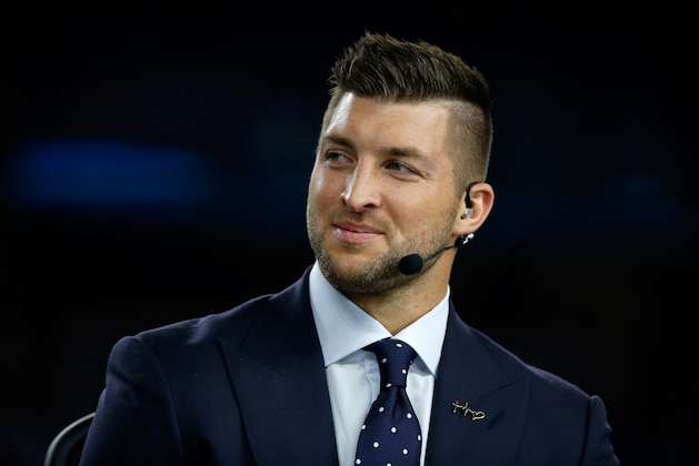 ARLINGTON, TX - DECEMBER 31:  Broadcaster Tim Tebow of the SEC Network speaks on air before the Goodyear Cotton Bowl at AT&T Stadium on December 31, 2015 in Arlington, Texas.  (Photo by Scott Halleran/Getty Images)