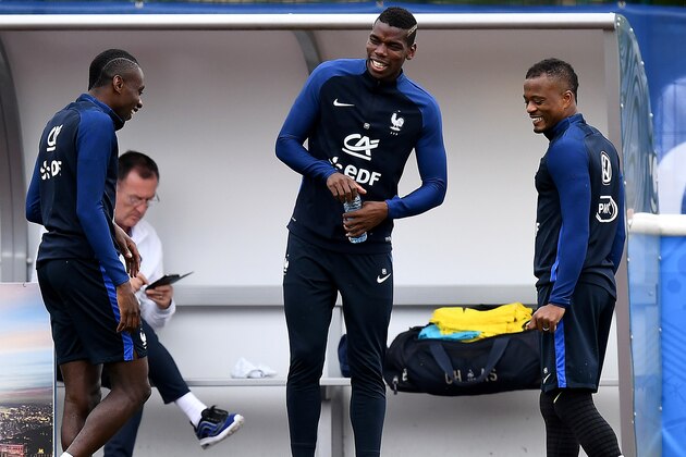 France's midfielder Blaise Matuidi and France's midfielder Paul Pogba (C) joke with France's defender Patrice Evra  during a training sessiosn in Clairefontaine en Yvelines on July 4, 2016, during the Euro 2016 football tournament.   / AFP / FRANCK FIFE        (Photo credit should read FRANCK FIFE/AFP/Getty Images)