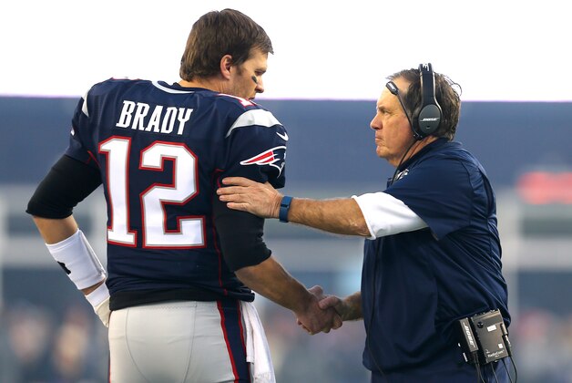 FOXBORO, MA - JANUARY 16: Tom Brady #12 and head coach Bill Belichick of the New England Patriots shake hands at the start of the AFC Divisional Playoff Game against the Kansas City Chiefs at Gillette Stadium on January 16, 2016 in Foxboro, Massachusetts.  (Photo by Maddie Meyer/Getty Images)