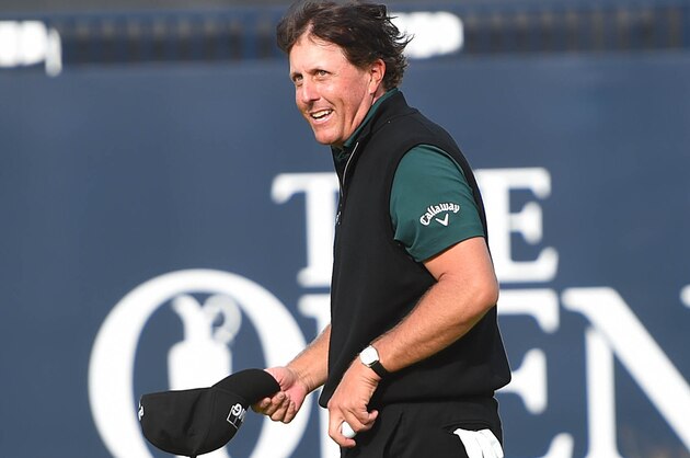 Jul 14, 2016; Ayrshire,  SCT; Phil Mickelson (USA) walks off the 18th green after finishing his first round round of the 145th Open Championship golf tournament at Royal Troon Golf Club - Old Course. Mandatory Credit: Thomas J. Russo-USA TODAY Sports
