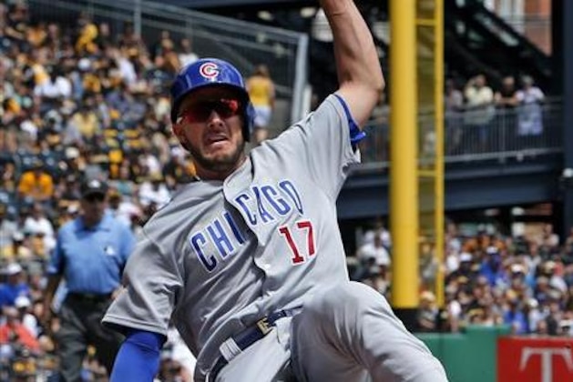 Chicago Cubs' Kris Bryant scores on a ground out to first base by Chicago Cubs' Albert Almora Jr. (5) in the third inning of a baseball game against the Pittsburgh Pirates in Pittsburgh, Sunday, July 10, 2016. The Cubs won 6-5. (AP Photo/Gene J. Puskar)