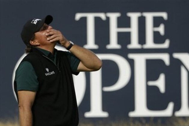 Phil Mickelson of the United States reacts as  he narrowly misses a birdie putt on the 18th green during the first round of the British Open Golf Championships at the Royal Troon Golf Club in Troon, Scotland, Thursday, July 14, 2016. (AP Photo/Matt Dunham)