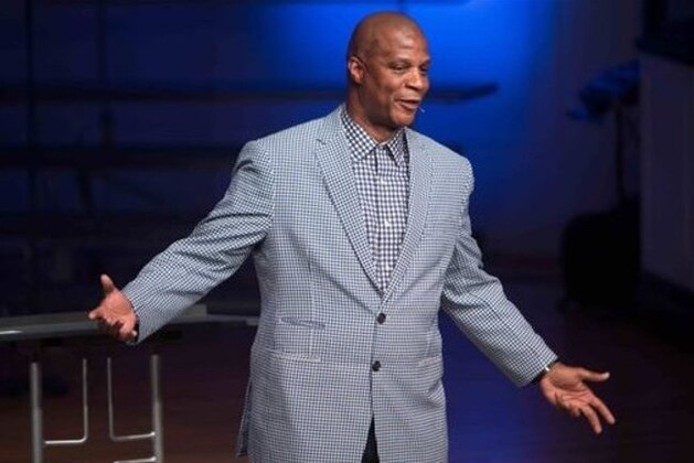 ADVANCE FOR WEEKEND EDITIONS, MAY 8-10 - In this April 24, 2015, photo former baseball player Darryl Strawberry gives a sermon in Bear, Del. His promising career was derailed by drug addiction, domestic violence, tax woes and a bout with a cancer. Strawberry is on a new path these days, speaking with his wife from the pulpit and spreading his story of redemption.  (AP Photo/Suchat Pederson)