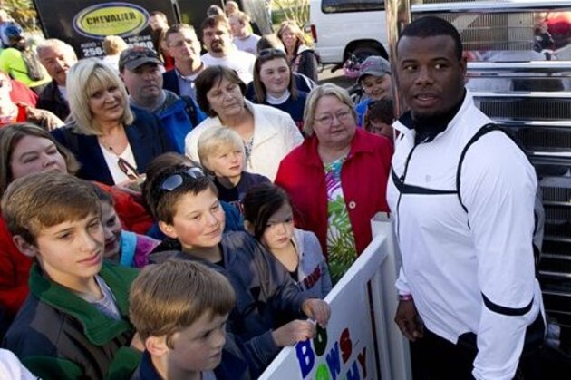 Former baseball great Ken Griffey Jr.,right, talks with fans as he prepares to participate in Bo Jackson's 300-mile bike ride to benefit Alabama tornado victims, Tuesday, April 24, 2012 in Henager, Ala. The ride is going to go through rural areas and communities hit hard by tornadoes last April 27.  Jackson hopes to raise $1 million for the governor's relief fund and to raise awareness for those still in need. (AP Photo/Dave Martin)