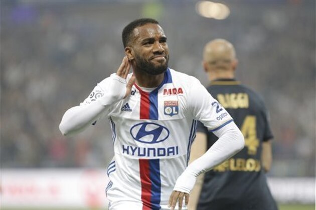 Lyon's Alexandre Lacazette celebrates after he scored a goal against Monaco during their French League One soccer match in Decines, near Lyon, central France, Saturday, May 7, 2016. (AP Photo/Laurent Cipriani)