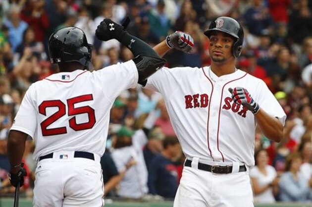 Boston Red Sox's Xander Bogaerts celebrates his home run with Jackie Bradley Jr. (25) during the fourth inning of a baseball game against the Tampa Bay Rays at Fenway Park in Boston Saturday, July 9, 2016. (AP Photo/Winslow Townson)