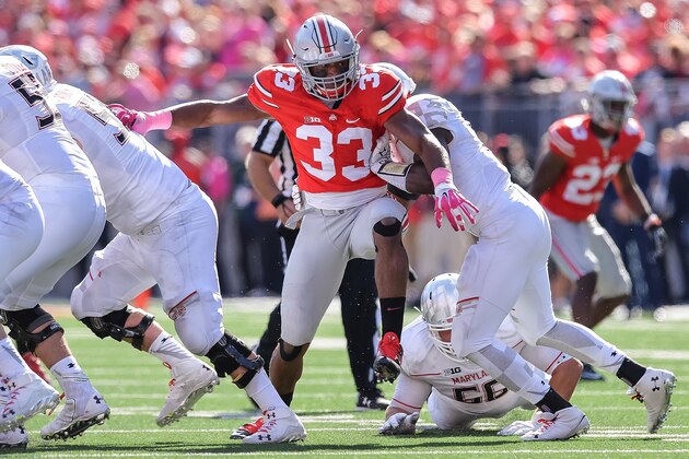 COLUMBUS, OH - OCTOBER 10:  Dante Booker #33 of the Ohio State Buckeyes attempts to get into the backfield against the Maryland Terrapins at Ohio Stadium on October 10, 2015 in Columbus, Ohio.  (Photo by Jamie Sabau/Getty Images)