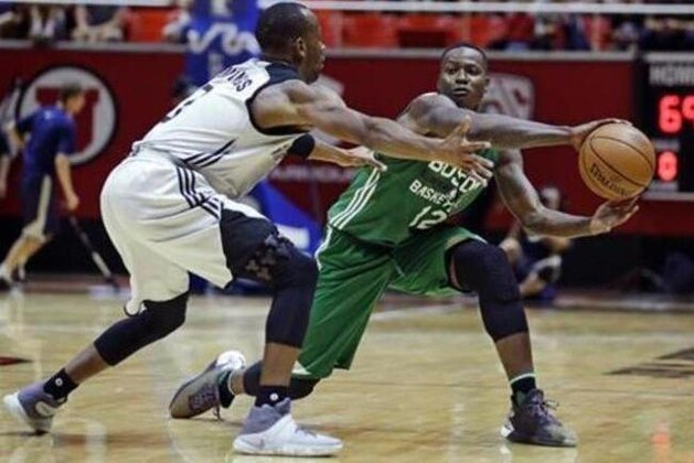 San Antonio Spurs guard Will Cummings, left, defends against Boston Celtics guard Terry Rozier (12) during the second half of an NBA summer league basketball game Thursday, July 7, 2016, in Salt Lake City. (AP Photo/Rick Bowmer)