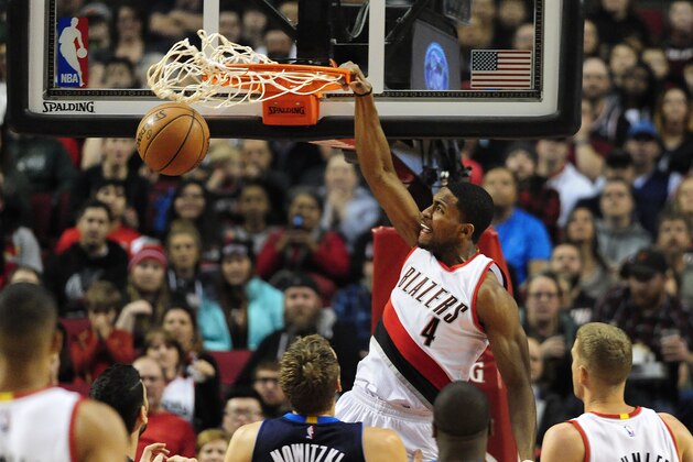 Mar 23, 2016; Portland, OR, USA; Portland Trail Blazers forward Maurice Harkless (4) dunks the ball against Dallas Mavericks forward Dirk Nowitzki (41) during the first quarter of the game at Moda Center at the Rose Quarter. Mandatory Credit: Steve Dykes-USA TODAY Sports