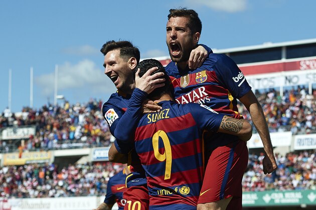 GRANADA, SPAIN - MAY 14:  Luis Suarez of FC Barcelona celebrates scoring his team's first goal with his teamates Lionel Messi and Jordi Alba during the La Liga match between Granada CF and FC Barcelona at Estadio Nuevo Los Carmenes on May 14, 2016 in Granada, Spain.  (Photo by Manuel Queimadelos Alonso/Getty Images)