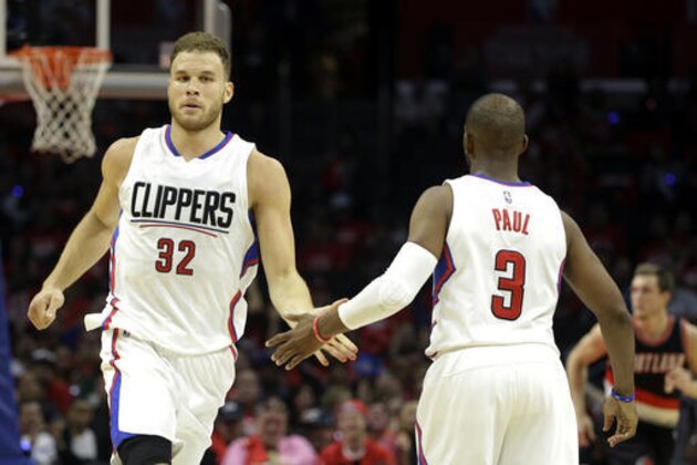 Los Angeles Clippers' Chris Paul, right, celebrates his 3-point basket with Blake Griffin in the second half in Game 1 of a first-round NBA basketball playoff series against the Portland Trail Blazers, Sunday, April 17, 2016, in Los Angeles. The Clippers won 115-95. (AP Photo/Jae C. Hong)