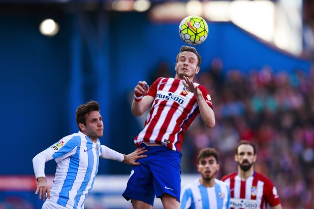 MADRID, SPAIN - APRIL 23: Saul Niguez of Atletico de Madrid saves on a header during the La Liga match between Club Atletico de Madrid and Malaga CF at Vicente Calderon Stadium on April 23, 2016 in Madrid, Spain.  (Photo by Gonzalo Arroyo Moreno/Getty Images)