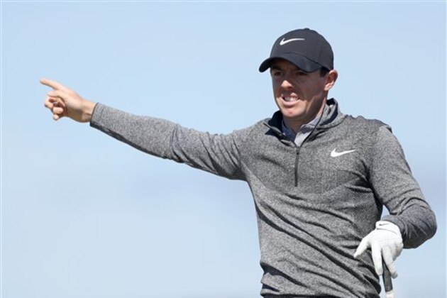 Rory McIlroy of Northern Ireland gestures as his shot off the 6th tee goes right during the first round of the British Open Golf Championship at the Royal Troon Golf Club in Troon, Scotland, Thursday, July 14, 2016. (AP Photo/Peter Morrison)