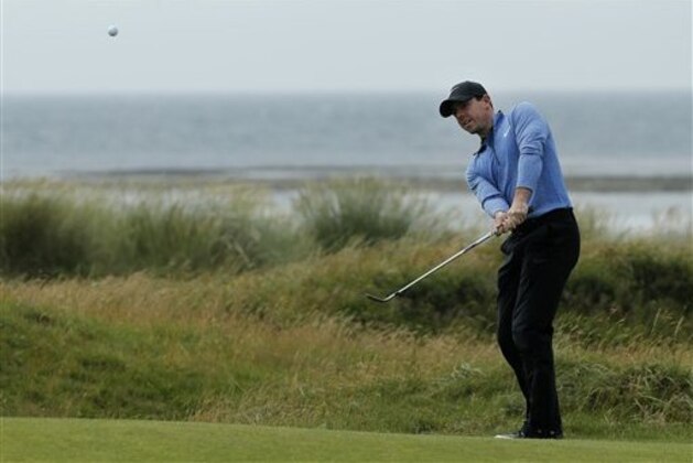 Rory McIlroy of Northern Ireland chips onto the 5th green during the second round of the British Open Golf Championship at the Royal Troon Golf Club in Troon, Scotland, Friday, July 15, 2016. (AP Photo/Ben Curtis)