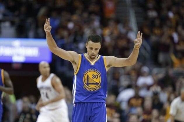 Golden State Warriors guard Stephen Curry (30) celebrates a basket against the Cleveland Cavaliers during the second half of Game 4 of basketball's NBA Finals in Cleveland, Friday, June 10, 2016. (AP Photo/Tony Dejak)