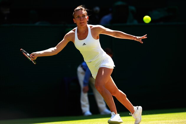 LONDON, ENGLAND - JULY 05:  Simona Halep of Romania plays a forehand during the Ladies Singles Quarter Finals match against Angelique Kerber of Germany on day eight of the  Wimbledon Lawn Tennis Championships at the All England Lawn Tennis and Croquet Club on July 5, 2016 in London, England.  (Photo by Adam Pretty/Getty Images)