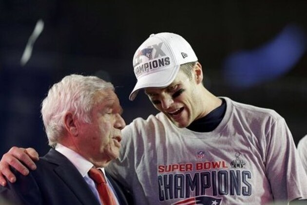 New England Patriots quarterback Tom Brady, right, celebrates with owner Robert Kraft after the NFL Super Bowl XLIX football game against the Seattle Seahawks Sunday, Feb. 1, 2015, in Glendale, Ariz. The Patriots won 28-24. (AP Photo/David Goldman)