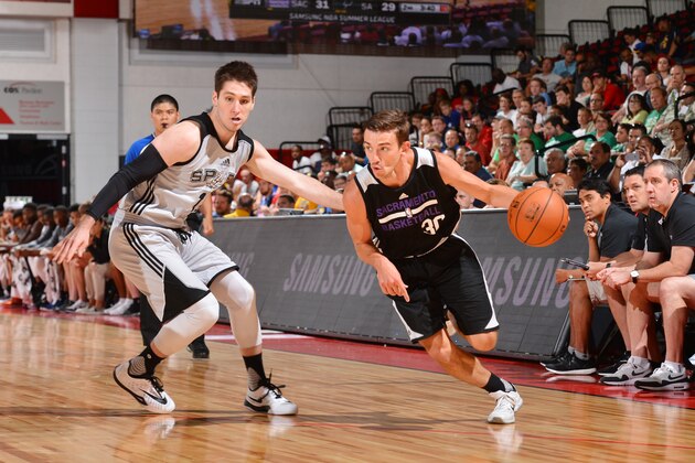 LAS VEGAS, NV - JULY 15:  David Stockton #30 of the Sacramento Kings drives to the basket against Ryan Arcidiacono #16 of the San Antonio Spurs during the 2016 NBA Las Vegas Summer League game on July 15, 2016 at the Cox Pavillion in Las Vegas, Nevada. NOTE TO USER: User expressly acknowledges and agrees that, by downloading and or using this photograph, User is consenting to the terms and conditions of the Getty Images License Agreement. Mandatory Copyright Notice: Copyright 2016 NBAE  (Photo by David Dow/NBAE via Getty Images)