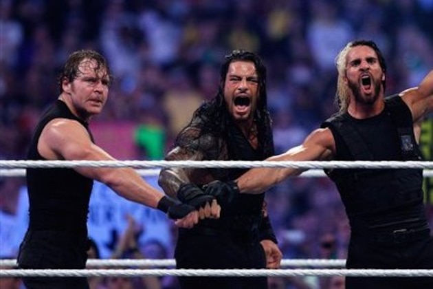 The Shield reacts after their win during Wrestlemania XXX at the Mercedes-Benz Super Dome in New Orleans on Sunday, April 6, 2014. (Jonathan Bachman/AP Images for WWE)