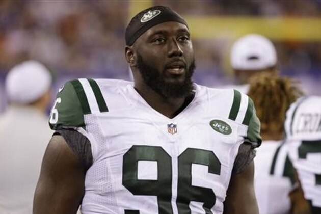 FILE - In this Saturday, Aug. 29, 2015 file photo, New York Jets defensive end Muhammad Wilkerson (96) walks the sidelines during the second half of a preseason NFL football game against the New York Giants in East Rutherford, N.J. The New York Jets have signed Muhammad Wilkerson to a five-year contract extension, beating the deadline after which the Pro Bowl defensive end would have had to play this season under the franchise tag amount of $15.7 million, Friday, July 15, 2016. (AP Photo/Seth Wenig, File)