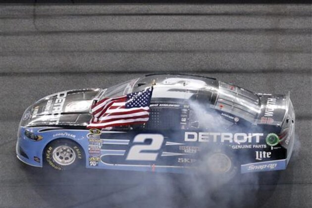 Brad Keselowski celebrates after winning the NASCAR Sprint Cup auto race at Daytona International Speedway, Saturday, July 2, 2016, in Daytona Beach, Fla. (AP Photo/Wilfredo Lee)
