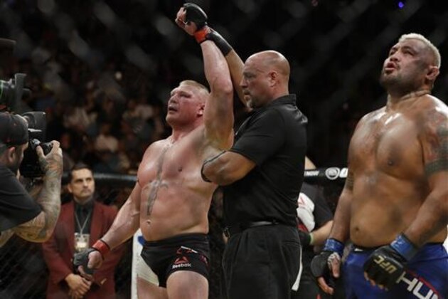 Brock Lesnar celebrates after defeating Mark Hunt during their heavyweight mixed martial arts bout at UFC 200, Saturday, July 9, 2016, in Las Vegas. (AP Photo/John Locher)