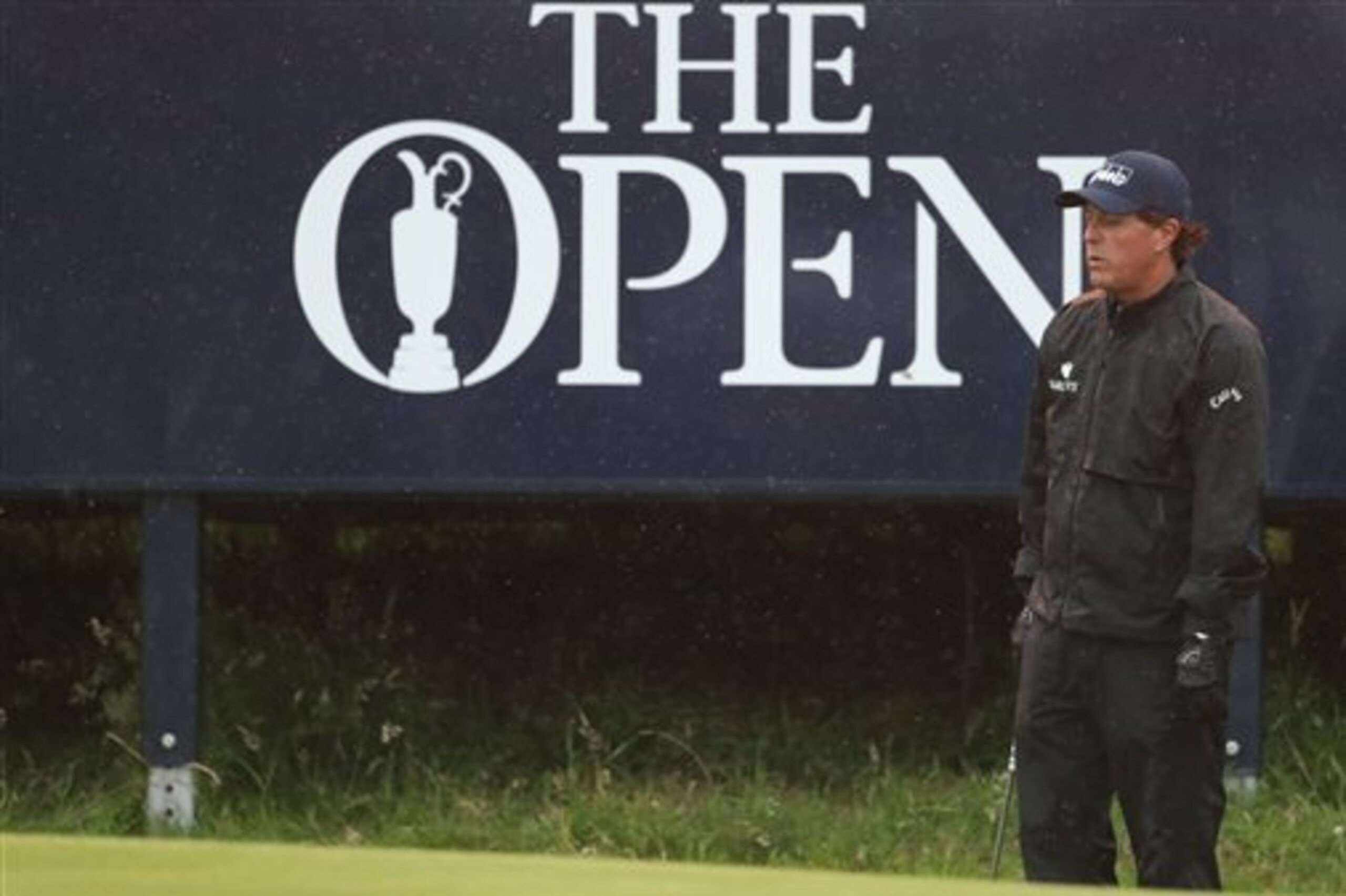 Phil Mickelson of the United States looks at his chip onto the 9th green during the second round of the British Open Golf Championships at the Royal Troon Golf Club in Troon, Scotland, Friday, July 15, 2016. (AP Photo/Peter Morrison)