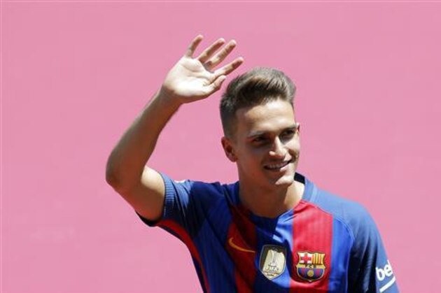 FC Barcelona's new signing Denis Suarez gestures during his official presentation at the Camp Nou stadium in Barcelona, Spain, Wednesday, July 6, 2016. Suarez signed with Barcelona for the next four seasons, with an option for a fifth that is dependent on his number of appearances in the fourth season. (AP Photo/Manu Fernandez)
