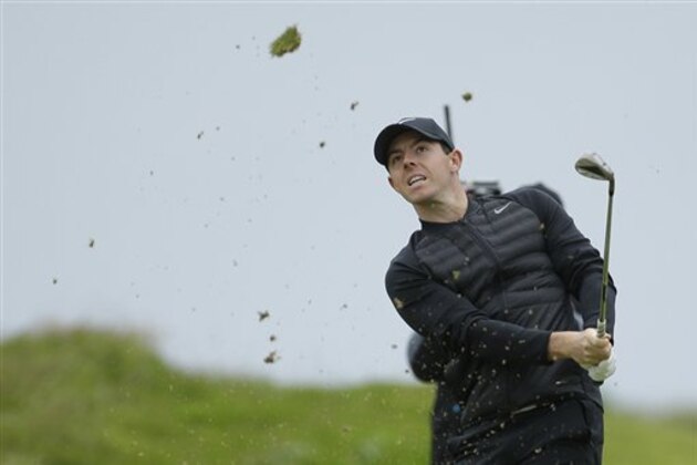 Rory McIlroy of Northern Ireland hits a shot from the 3rd fairway during the third round of the British Open Golf Championship at the Royal Troon Golf Club in Troon, Scotland, Saturday, July 16, 2016. (AP Photo/Matt Dunham)