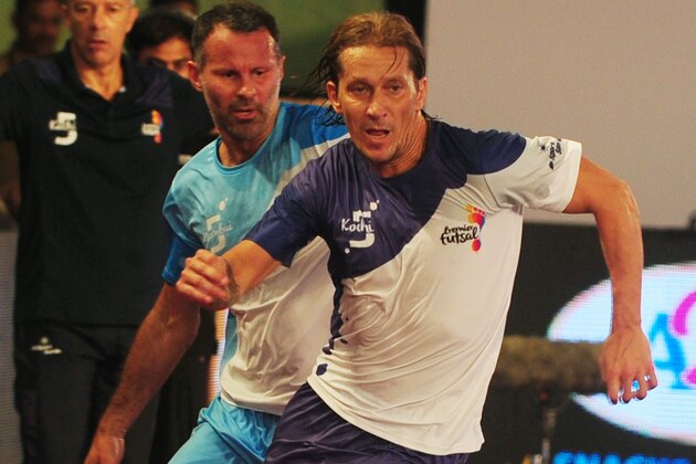 Kochi's Miguel Salgado (R) plays against Rayan Gibbs of the Mumbai 5's during their Premier Futsal Football League match in Chennai on July 16, 2016. / AFP / ARUN SANKAR        (Photo credit should read ARUN SANKAR/AFP/Getty Images)
