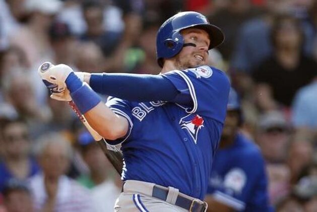 Toronto Blue Jays' Justin Smoak follows through on an RBI-single during the fourth inning of a baseball game against the Boston Red Sox Saturday, June 4, 2016, in Boston. (AP Photo/Michael Dwyer)