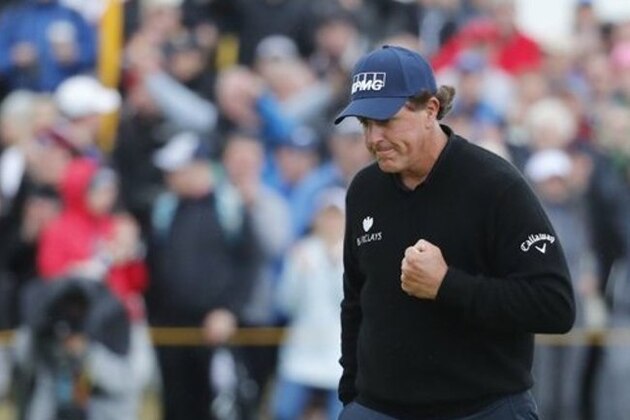 Phil Mickelson of the United States celebrates after making a birdie on the 13th green during the third round of the British Open Golf Championship at the Royal Troon Golf Club in Troon, Scotland, Saturday, July 16, 2016. (AP Photo/Ben Curtis)