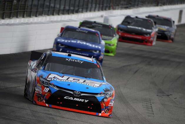 LOUDON, NH - JULY 16:  Kyle Busch, driver of the #18 NOS Energy Drink Toyota, leads a pack of cars during the NASCAR XFINITY Series AutoLotto 200 at New Hampshire Motor Speedway on July 16, 2016 in Loudon, New Hampshire.  (Photo by Jonathan Moore/Getty Images)