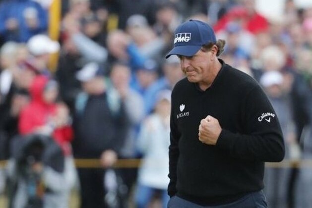 Phil Mickelson of the United States celebrates after making a birdie on the 13th green during the third round of the British Open Golf Championship at the Royal Troon Golf Club in Troon, Scotland, Saturday, July 16, 2016. (AP Photo/Ben Curtis)
