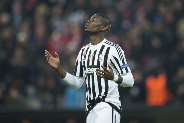 Juventus' midfielder from France Paul Pogba celebrates scoring the opening goal during the UEFA Champions League, Round of 16, second leg football match FC Bayern Munich v Juventus in Munich, southern Germany on March 16, 2016. / AFP / ODD ANDERSEN        (Photo credit should read ODD ANDERSEN/AFP/Getty Images)