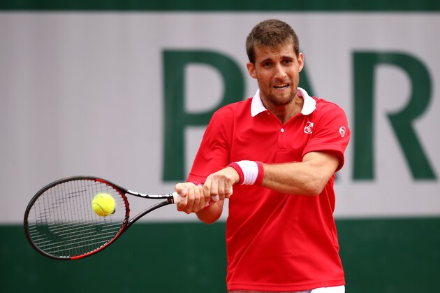 PARIS, FRANCE - MAY 23:  Martin Klizan of Slovakia hits a backhand during the Men's Singles first round match against Taro Daniel of Japan on day two of the 2016 French Open at Roland Garros on May 23, 2016 in Paris, France.  (Photo by Clive Brunskill/Getty Images)