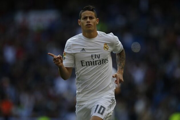 Real Madrid's James Rodriguez celebrates after scoring the opening goal against Eibar during the Spanish La Liga soccer match between Real Madrid and Eibar at the Santiago Bernabeu stadium in Madrid, Saturday, April 9, 2016. Rodriguez scored the first goal in Real Madrid's 4-0 victory. (AP Photo/Francisco Seco)