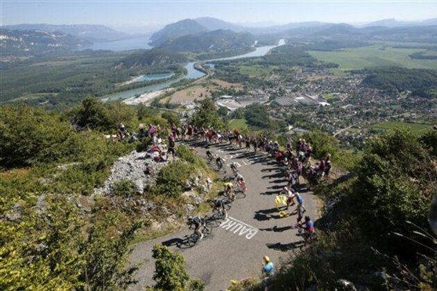The group of leaders with Britain's Chris Froome, wearing the overall leader's yellow jersey, climb Colombier pass during the fifteenth stage of the Tour de France cycling race over 160 kilometers (99.4 miles) with start in Bourg-en-Bresse and finish in Culoz, France, Sunday, July 17, 2016. (AP Photo/Christophe Ena)