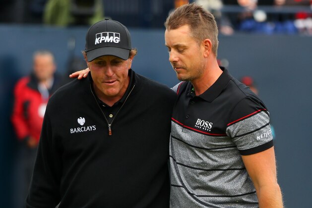 TROON, SCOTLAND - JULY 17:  Henrik Stenson of Sweden celebrates victory as he walks off the 18th green with Phil Mickelson of the United States after the final round on day four of the 145th Open Championship at Royal Troon on July 17, 2016 in Troon, Scotland. Henrik Stenson of Sweden finished 20 under for the tournament to claim the Open Championship.  (Photo by Andrew Redington/Getty Images)