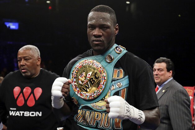 Jan 16, 2016; Brooklyn, NY, USA; Deontay Wilder celebrates after knocking out Artur Szpilka in the ninth round of their heavyweight title boxing fight at Barclays Center. Wilder defeated Szpilka via ninth round knockout. Mandatory Credit: Adam Hunger-USA TODAY Sports