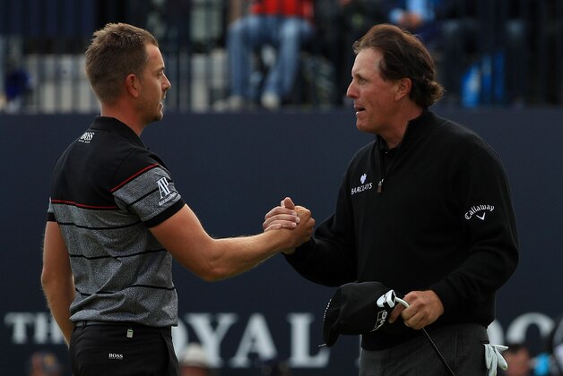 TROON, SCOTLAND - JULY 17:  Henrik Stenson of Sweden celebrates victory on the 18th green with Phil Mickelson of the United States after the final round on day four of the 145th Open Championship at Royal Troon on July 17, 2016 in Troon, Scotland. Henrik Stenson of Sweden finished 20 under for the tournament to claim the Open Championship.  (Photo by Mike Ehrmann/Getty Images)