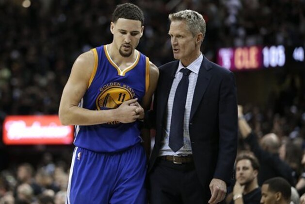 Golden State Warriors guard Klay Thompson (11) talks with head coach Steve Kerr against the Cleveland Cavaliers during the second half of Game 6 of basketball's NBA Finals in Cleveland, Thursday, June 16, 2016. Cleveland won 115-101. (AP Photo/Tony Dejak)