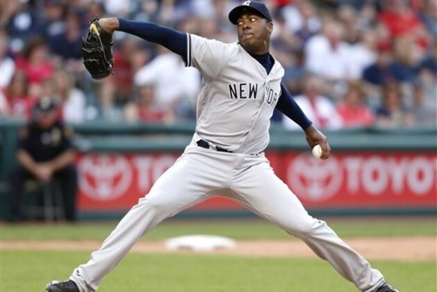 New York Yankees relief pitcher Aroldis Chapman deilvers against the Cleveland Indians during the tenth inning of a baseball game Saturday, July 9, 2016, in Cleveland. (AP Photo/Ron Schwane)