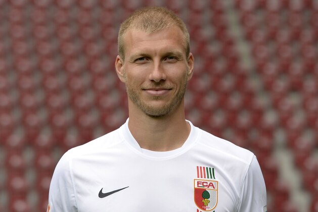 Augsburg's Estonian defender Ragnar Klavan poses during the team presentation of the German first division Bundesliga team FC Augsburg at the stadium in Augsburg, southern Germany, on July 8, 2015. AFP PHOTO / CHRISTOF STACHE        (Photo credit should read CHRISTOF STACHE/AFP/Getty Images)