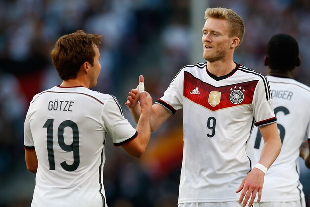 COLOGNE, GERMANY - JUNE 10:  Mario Goetze of Germany celebrates after scoring his team's first goal with team mate Andre Schuerrle (R) during the International Friendly match between Germany and USA at RheinEnergieStadion on June 10, 2015 in Cologne, Germany.  (Photo by Boris Streubel/Getty Images)