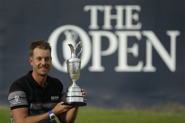 Henrik Stenson of Sweden poses with the trophy after winning the British Open Golf Championships at the Royal Troon Golf Club in Troon, Scotland, Sunday, July 17, 2016. (AP Photo/Matt Dunham)