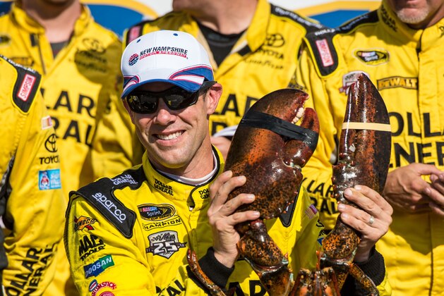 Jul 17, 2016; Loudon, NH, USA; Sprint Cup Series driver Matt Kenseth (20) poses with his victory lobster after winning the New Hampshire 301 at the New Hampshire Motor Speedway. Mandatory Credit: Jerome Miron-USA TODAY Sports