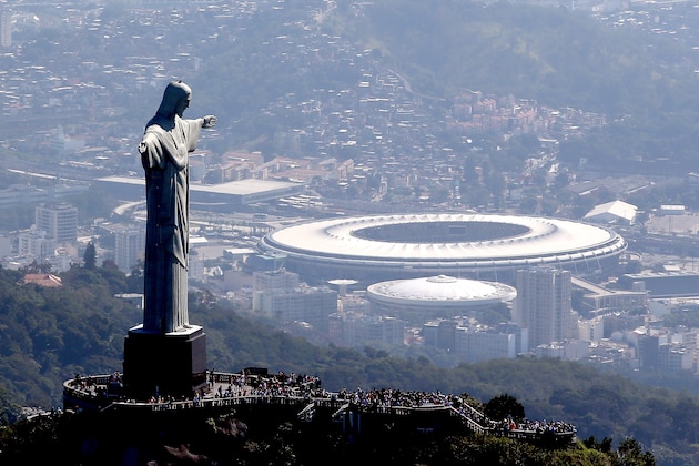 RIO DE JANEIRO, BRAZIL - JULY 04:  Aerial view of Christ the Redeemer with Maracana Stadium in the background  in preparation for the 2016 Olympic Games on July 4, 2016 in Rio de Janeiro, Brazil.  (Photo by Matthew Stockman/Getty Images)